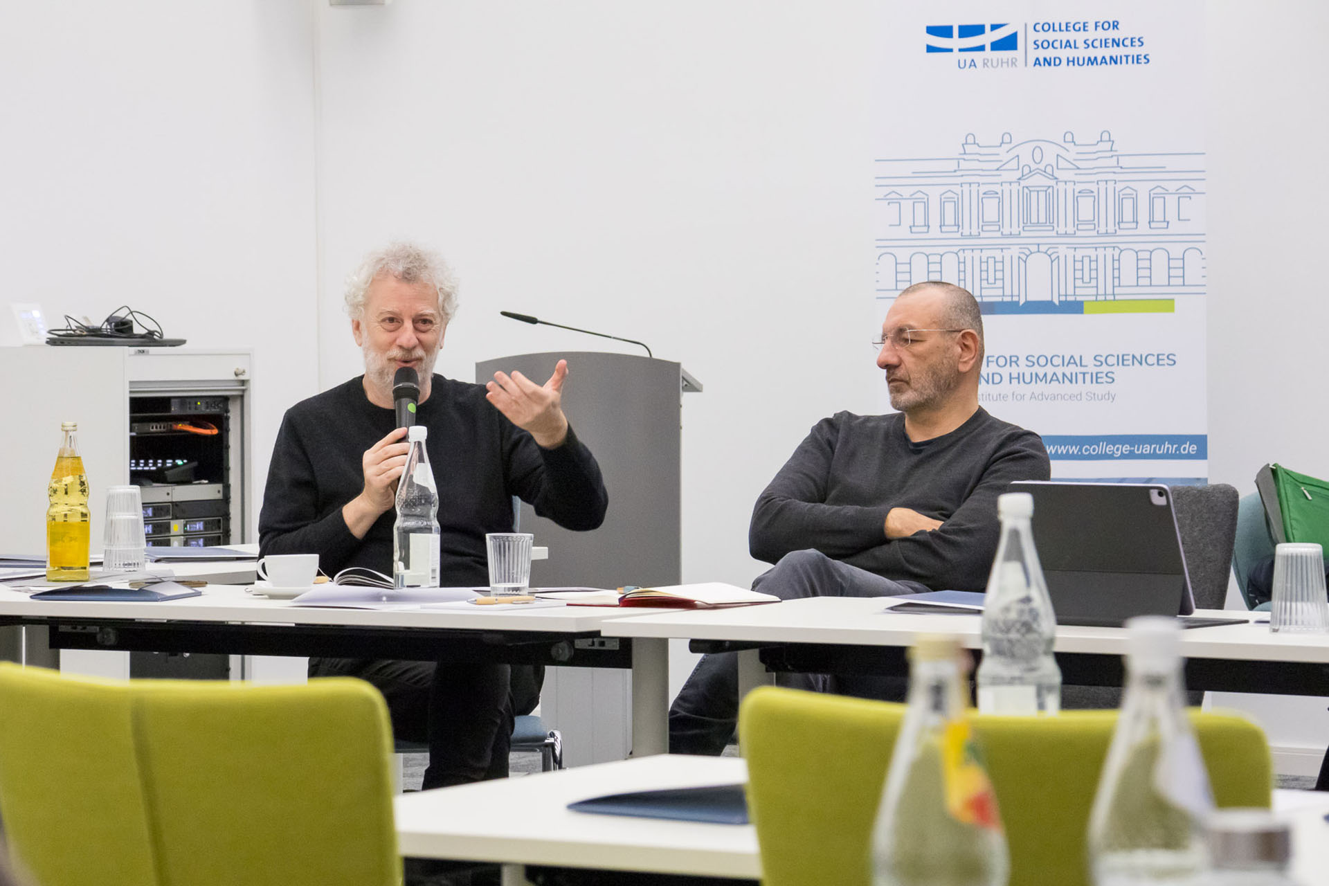 photo from the workshop, Prof. Feierstein speaking, Prof. Gudehus sitting to his right