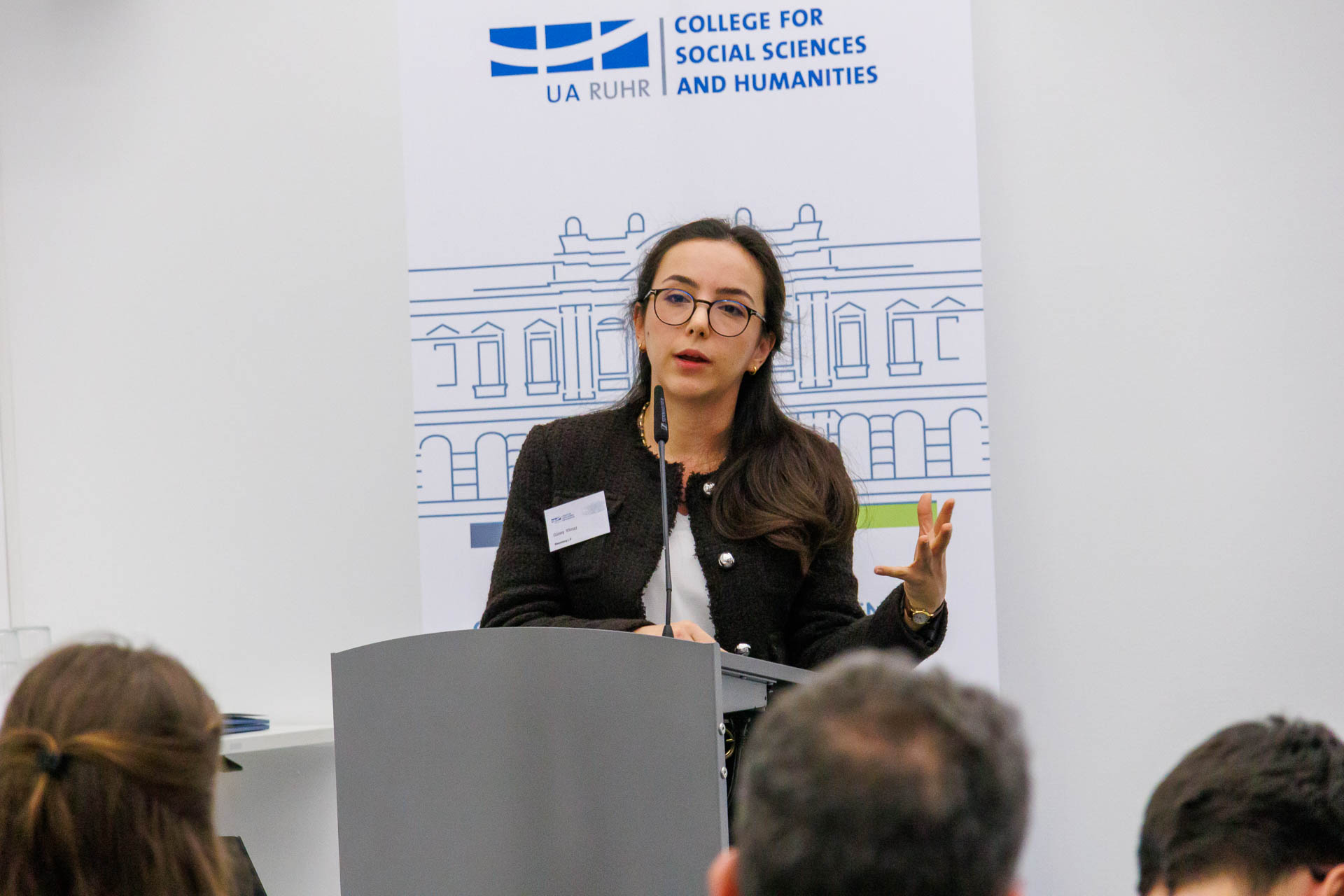 photo from the conference, speaker addressing the audience