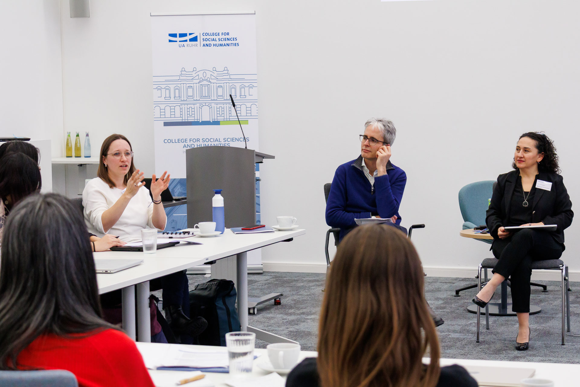 photo from the workshop 'Ethnic-Racial Socialisation', one person talking, the two convenors listening